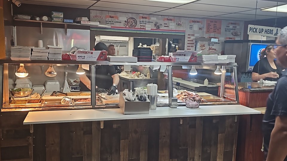Casual Mexican restaurant tables with simple seating.