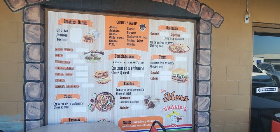 Printed menu showing tacos, bowls, and sides.