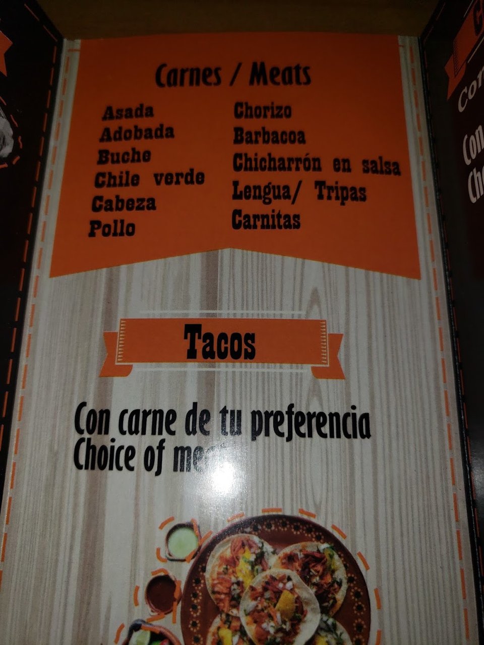 Menu board with seafood, fries, and rice plates.